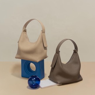 Half-moon shape soft pebbled leather handbag