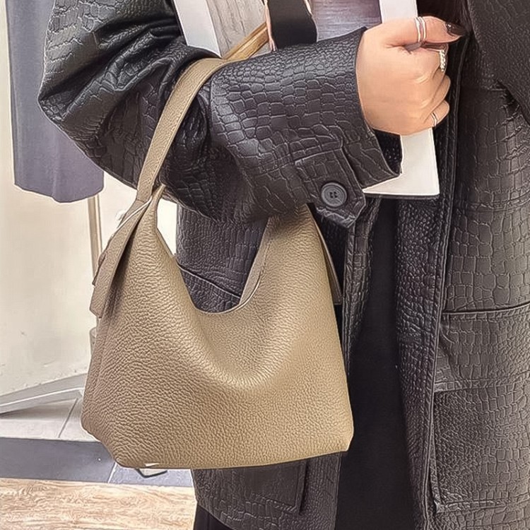Half-moon shape soft pebbled leather handbag